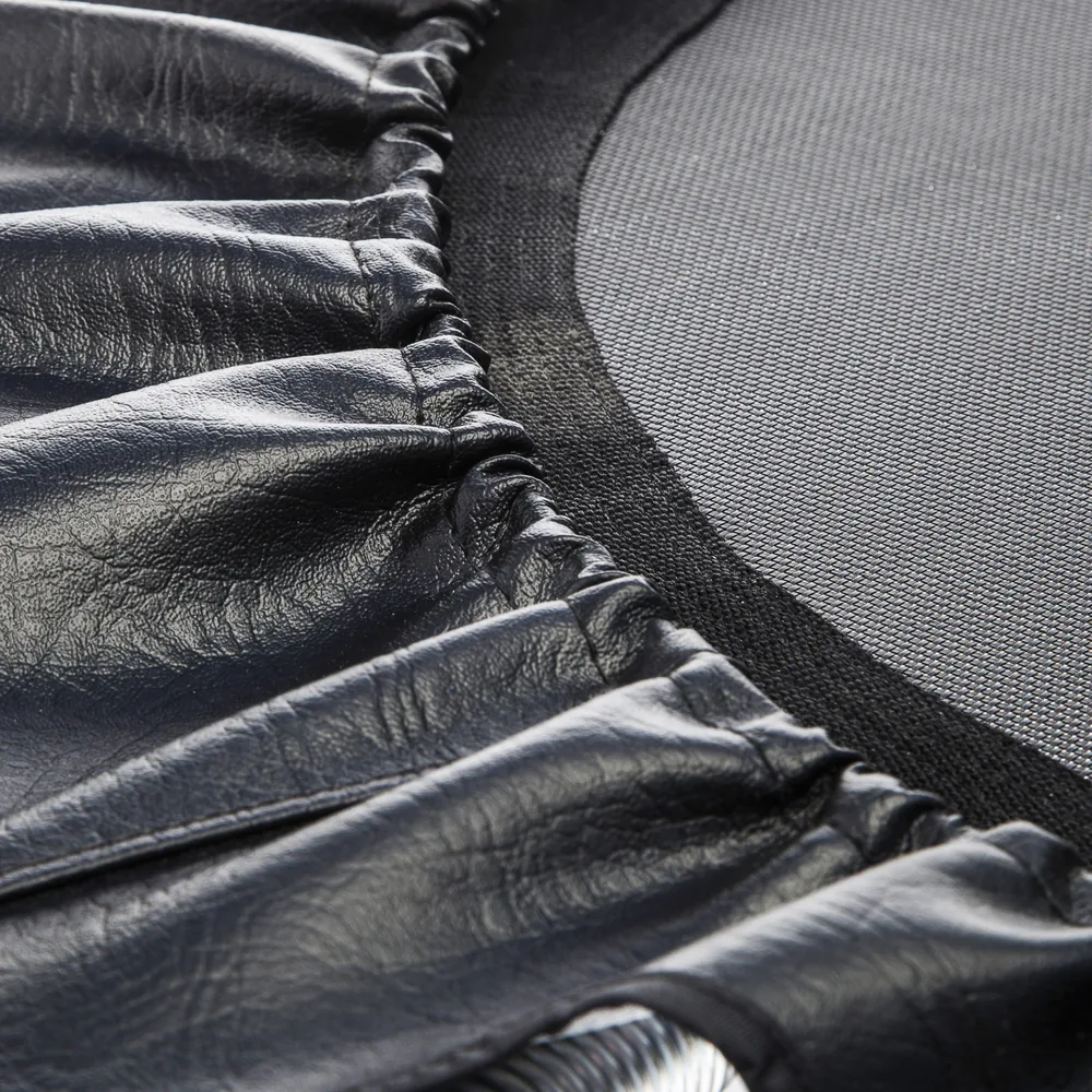 Close view of the Cellerciser mat edge beneath the padded spring cover