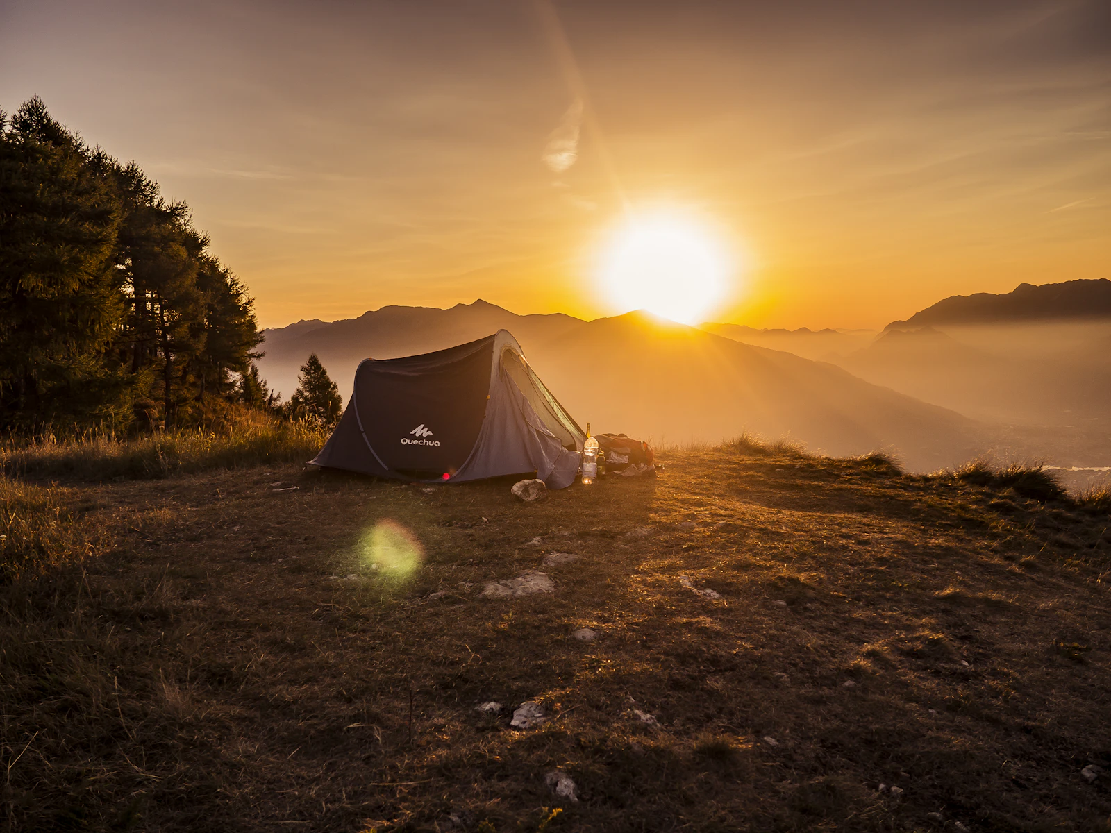 Tent pitched at sunset in the mountains