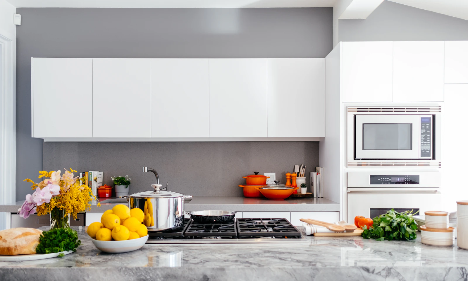 Bright organized kitchen with produce on the counter