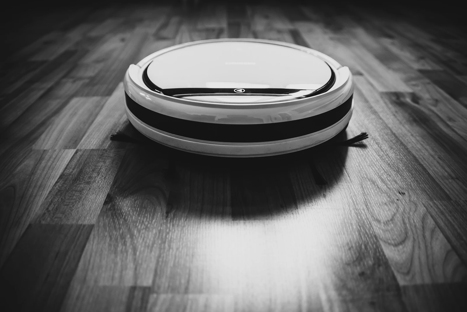 Robot vacuum cleaning a hardwood floor during testing