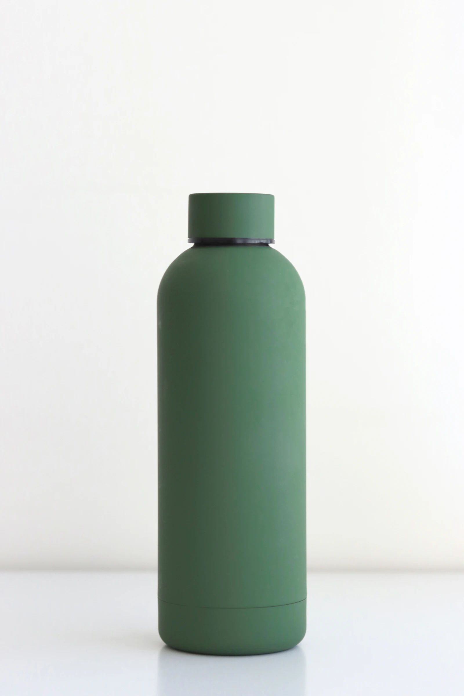 Insulated steel water bottle on a minimal background